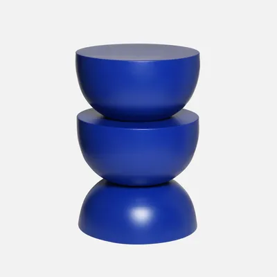 A stack of three blue, bowl-shaped objects, likely a side table.