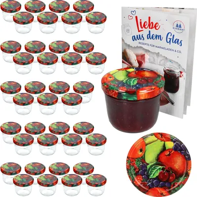 A set of small glass jars with decorative lids, a jar filled with jam, and a recipe book.