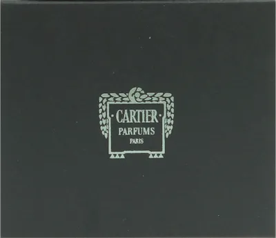 A close-up of a black box with a light-colored logo and text.