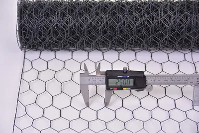 A roll of hexagonal wire mesh is shown, with a digital caliper measuring the mesh size.