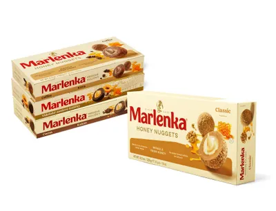 Several boxes of Marlenka Honey Nuggets are stacked and displayed next to a single box.