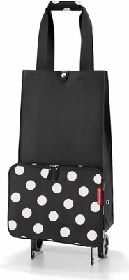 A black shopping trolley with white polka dots on the front pocket, shown against a white background.