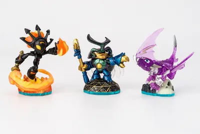 Three Skylanders figures are displayed on a white background.