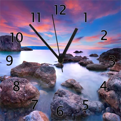 Produktbild von Wallario Design Wanduhr Seelandschaft in blau und rot mit großen Felsen aus Echtglas, Größe 30 x 30 cm