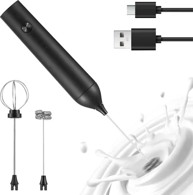 A black electric milk frother with two attachments and USB charging cables, shown with milk splashing.