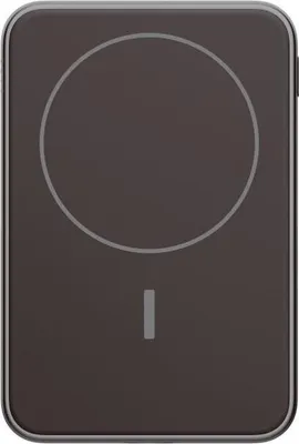 A top-down view of a dark gray wireless magnetic power bank with a light gray circular outline and a vertical line indicator.