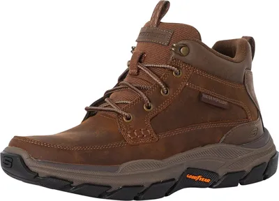 A brown leather boot is shown against a white background.