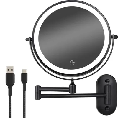A black wall-mounted makeup mirror with LED lighting and two USB cables.