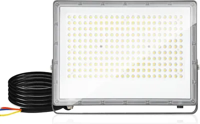 A floodlight with a coiled power cord and exposed wires.