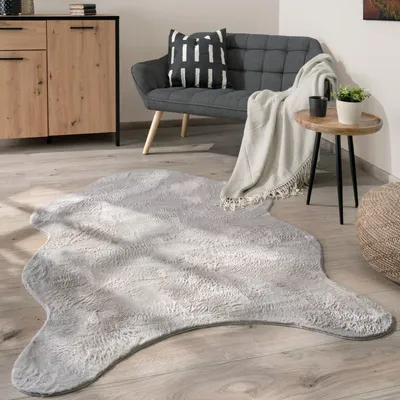 Produktbild von Teppich Wohnzimmer Kurzflor Modernes Kunstfell Fellform Weich Einfarbig Rutschfest Grösse 60x90 cm Fell-form