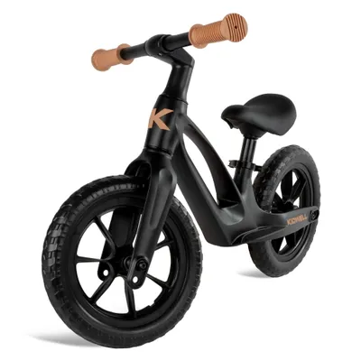 A black balance bike with brown handlebars and grips, shown from a front-diagonal angle against a white background.