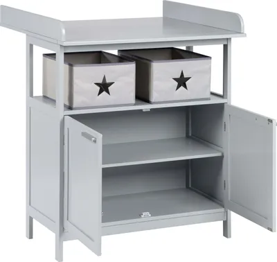 A light gray changing table with two storage boxes on top and a cabinet with two shelves and two doors below.