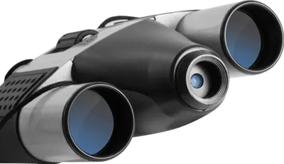 A close-up, angled view of a pair of binoculars against a white background.
