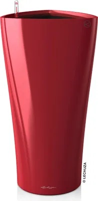 A tall, red, high-gloss planter with a water level indicator visible at the top.