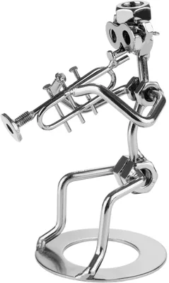 A metal figurine of a musician playing a trumpet, made from nuts, bolts, and other hardware.