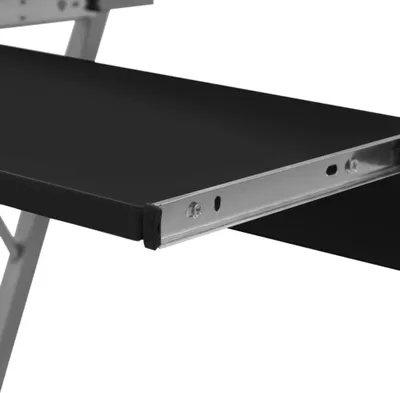 A close-up view of a black computer desk shelf with metal drawer slides.