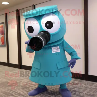 Productafbeelding van Teal camera mascotte REDBROKOLY kostuum karakter gekleed met een jurk broek en hoofdbanden