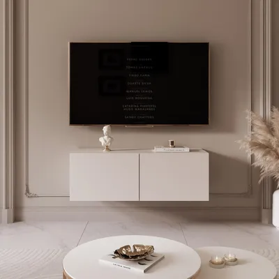 A modern living room with a wall-mounted TV and media console.
