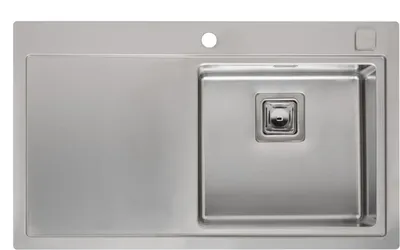 A top-down view of a stainless steel sink with a drainboard on the left and a basin on the right.