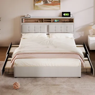 A bed with a headboard featuring storage and charging ports, set up in a bedroom with a rug and a nightstand.
