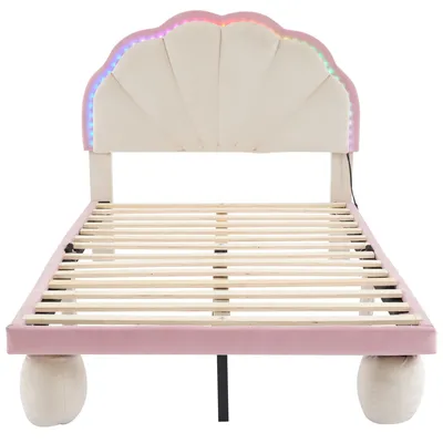 A bed frame with a shell-shaped headboard and LED lights.