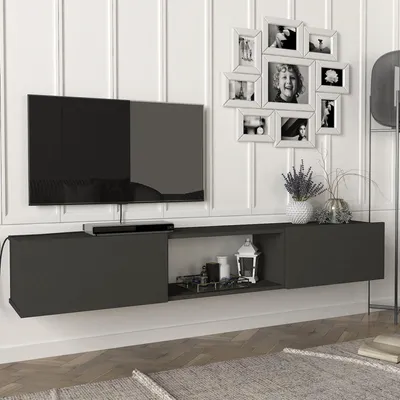 A modern living room setup with a wall-mounted TV and media console.