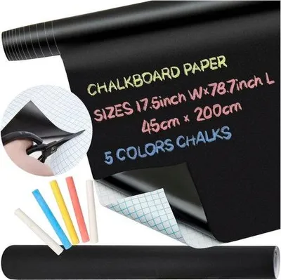 A roll of black chalkboard paper with chalk sticks and scissors.