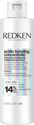 A white bottle of Redken Acidic Bonding Concentrate Intensive Treatment.