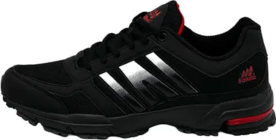 A side view of a black athletic shoe with red accents.