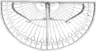 A white metal half-round table with decorative scrollwork.