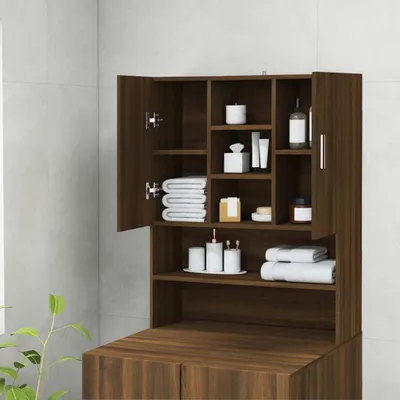 A bathroom cabinet with its doors open, showing shelves stocked with toiletries and towels.