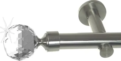 Close-up of a curtain rod end with a crystal decorative ball.