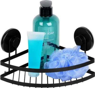 A black metal corner shower shelf with suction cups, holding a teal bottle of body soap, a blue tube of liquid, and a blue mesh bath pouf.