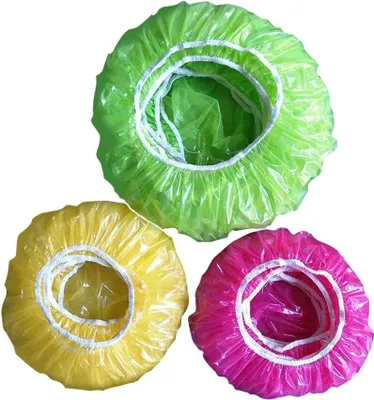 Three colorful shower caps are arranged in a cluster on a white background.