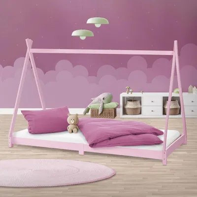 A child's bedroom with a pink tipi-style bed, bedding, stuffed animals, and storage units.