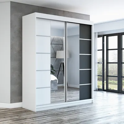 A modern white and black sliding door wardrobe with mirrored panels is shown in a room with a grey textured wall and wooden floor.