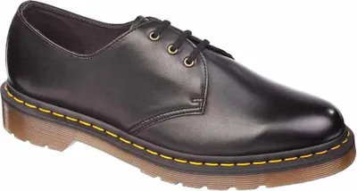 A single black Dr. Martens shoe is shown against a white background.