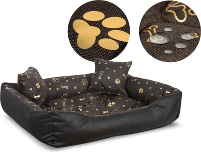 A dog bed with paw print and bone patterns, shown with close-up insets highlighting the fabric texture and water resistance.