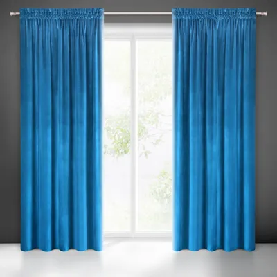 Two blue curtains hanging in front of a window.