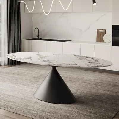 A modern dining room or kitchen setting with a marble-topped oval dining table with a black conical base.
