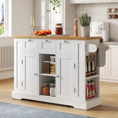 A white kitchen island with a wooden countertop is shown in a kitchen setting.