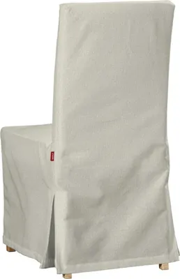 A chair covered with a slipcover, shown from the back and side.