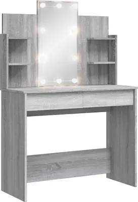 A vanity table with a mirror and LED lights.