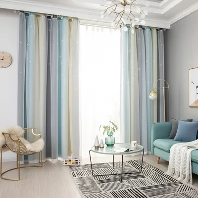 A living room scene with curtains, furniture, and decor.
