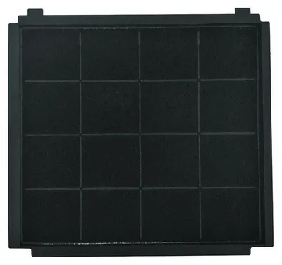 A close-up, top-down view of a black charcoal filter for a kitchen appliance.