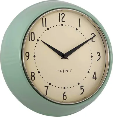 A close-up, studio shot of a green wall clock.