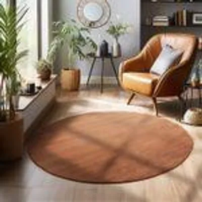 A round brown rug in a living room setting with a chair and plants.