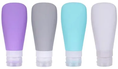 Produktbild von UNIQ Wiederverwendbare Silikon Reiseflaschen Set (4 x 90ml) Auslaufsichere Kosmetikbehälter mit Kulturbeutel