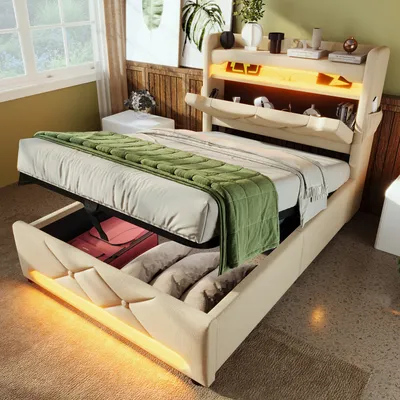 A bedroom scene with a bed that has storage underneath and a lighted headboard.