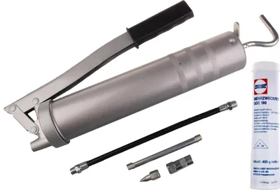 A set of tools for greasing, including a grease gun, flexible hose, and a cartridge of grease.